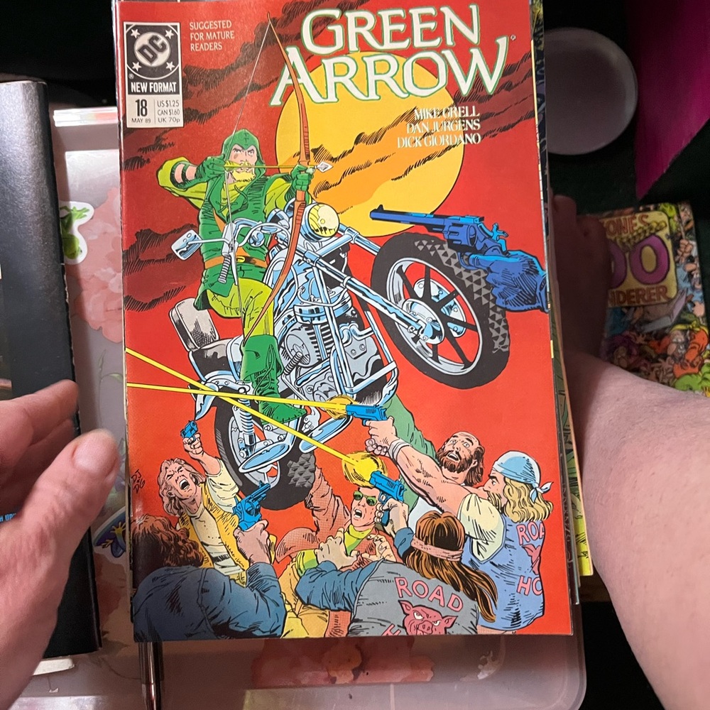 Vibrant Green Arrow Comic Cover with Motorcycle Action